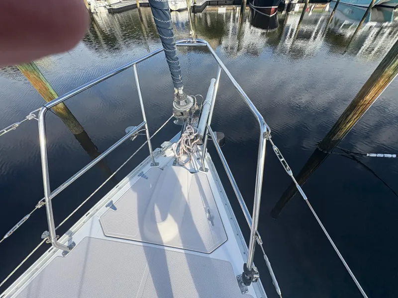 Slide: The Image of Close-up of a Catalina 355 sailboat's bow and rigging over calm water. - 40