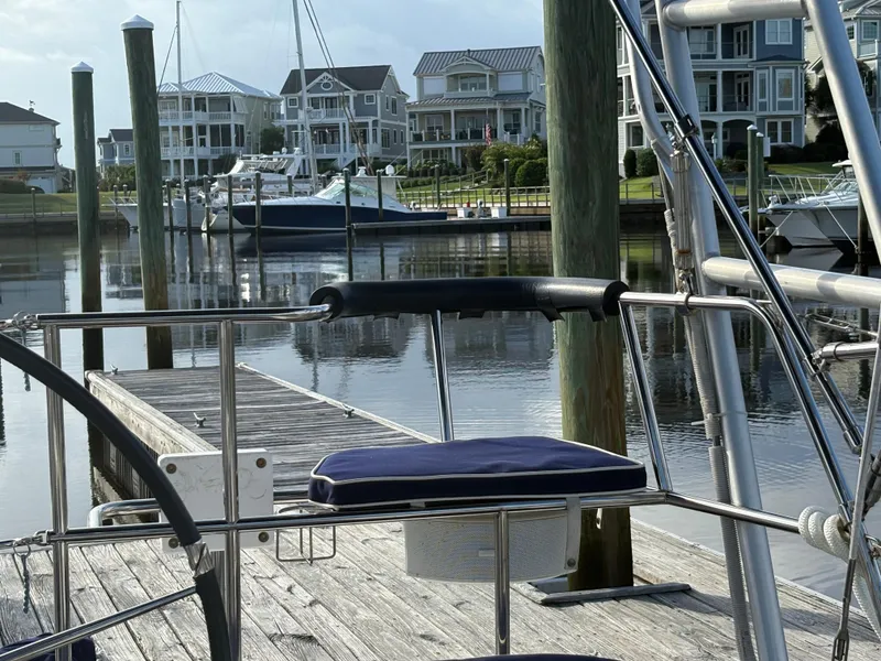 Slide: The Image of Docked Catalina 355 sailboat, 2011 model, with waterfront homes in the background. - 42