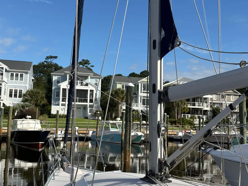 Slide: The Image of Sailboat docked in marina with waterfront homes, Catalina 355, 2011 model. - 43