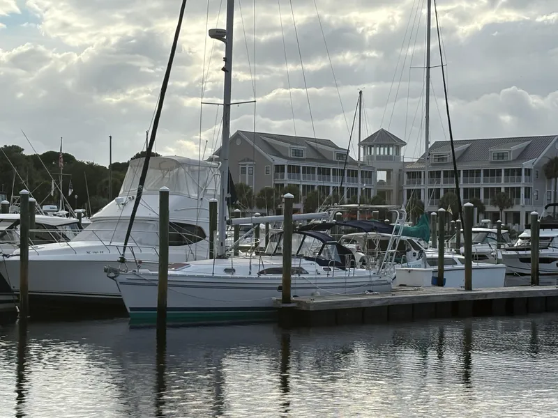 Slide: The Image of Sailboats docked at a marina with a 2011 Catalina 355 in the foreground. - 45