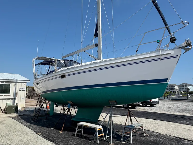 Slide: The Image of Catalina 355 sailboat from 2011 on dry dock, with clear blue sky background. - 49