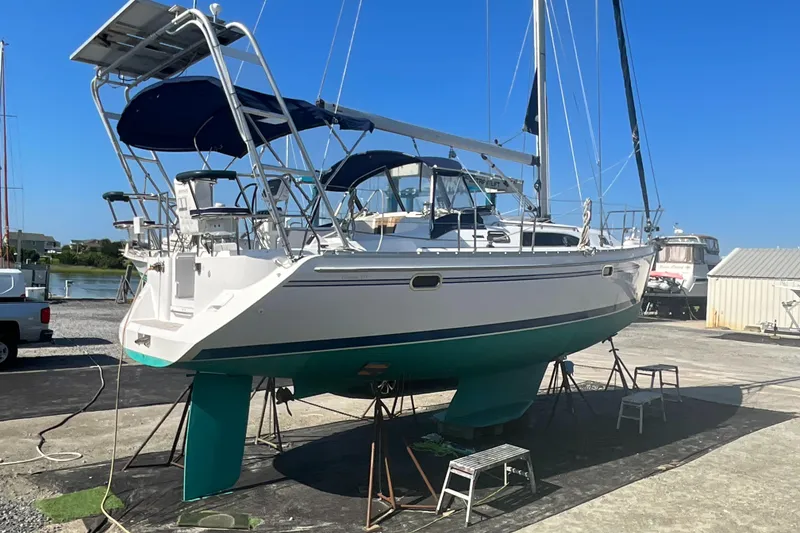 Slide: The Image of Sailboat Catalina 355, 2011 model, on dry dock with blue sky background. - 50