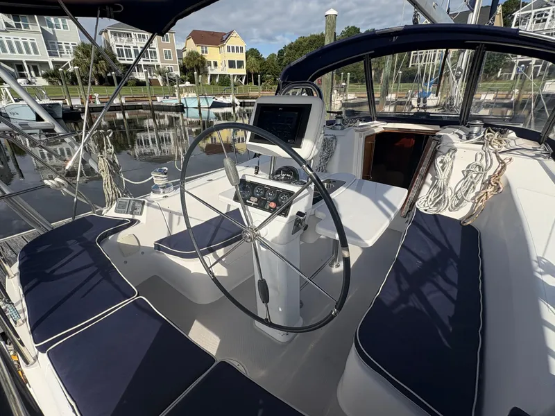 Slide: The Image of Cockpit of 2011 Catalina 355 sailboat with steering wheel and navigation equipment. - 6
