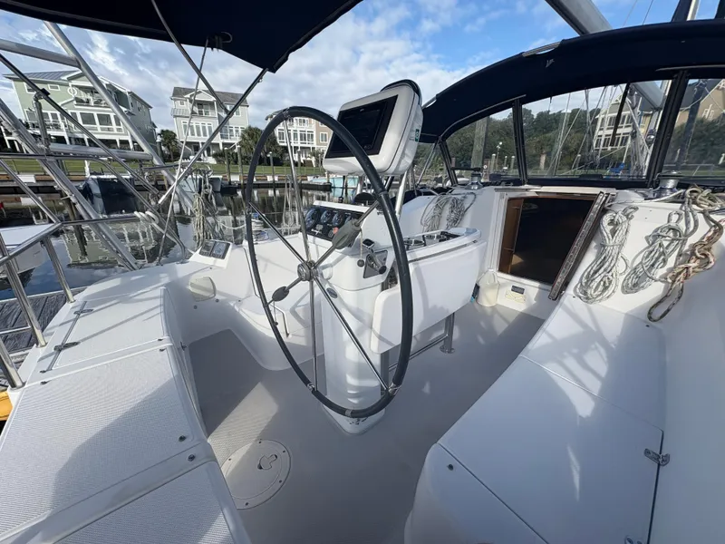 Slide: The Image of Cockpit of 2011 Catalina 355 sailboat with steering wheel and navigation instruments. - 7