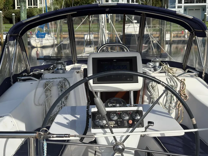 Slide: The Image of Cockpit of a 2011 Catalina 355 sailboat with steering wheel and navigation instruments. - 8
