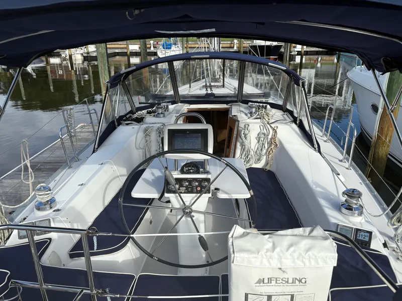 Slide: The Image of Cockpit of a 2011 Catalina 355 sailboat with navigation equipment and Lifesling. - 9