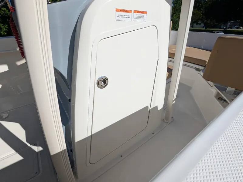 Slide: The Image of 2025 Bayliner Trophy T20CC boat interior with storage compartment. - 24