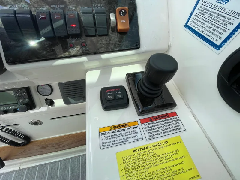 Slide: The Image of Interior of 2010 Sea Ray 450 Sundancer yacht with beige seating and wooden accents. - 12