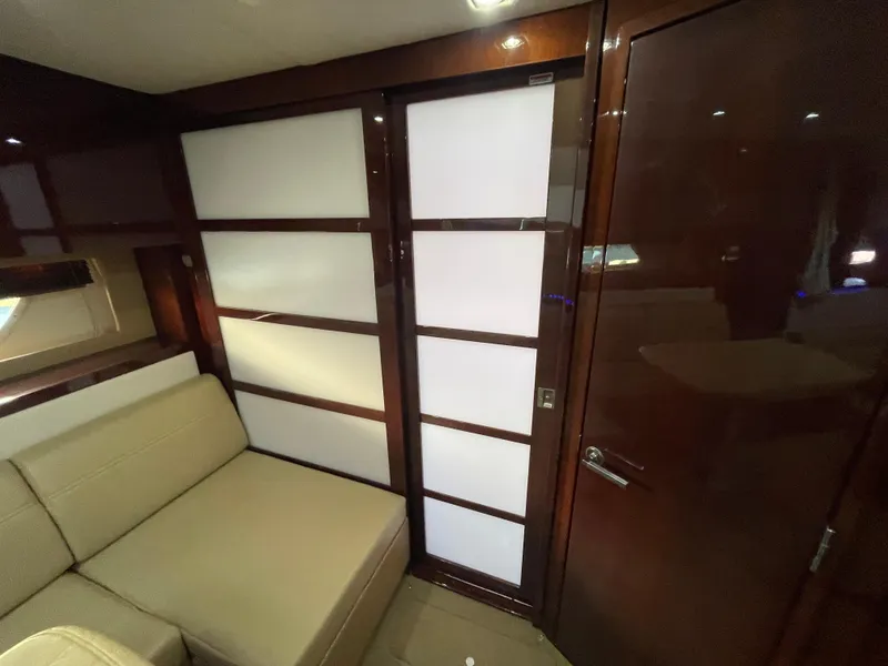 Slide: The Image of Engine room of a 2010 Sea Ray 450 Sundancer, showcasing dual engines and mechanical components. - 31