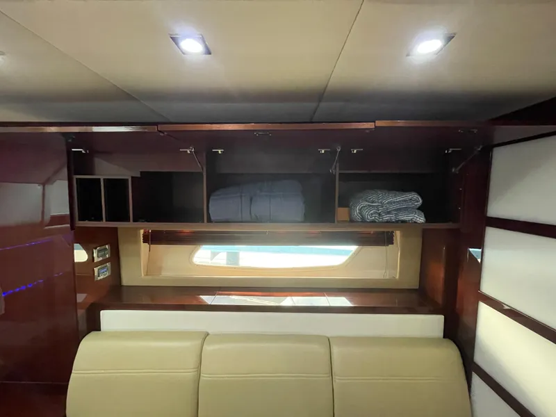 Slide: The Image of Interior of 2010 Sea Ray 450 Sundancer with storage cabinets and window. - 32