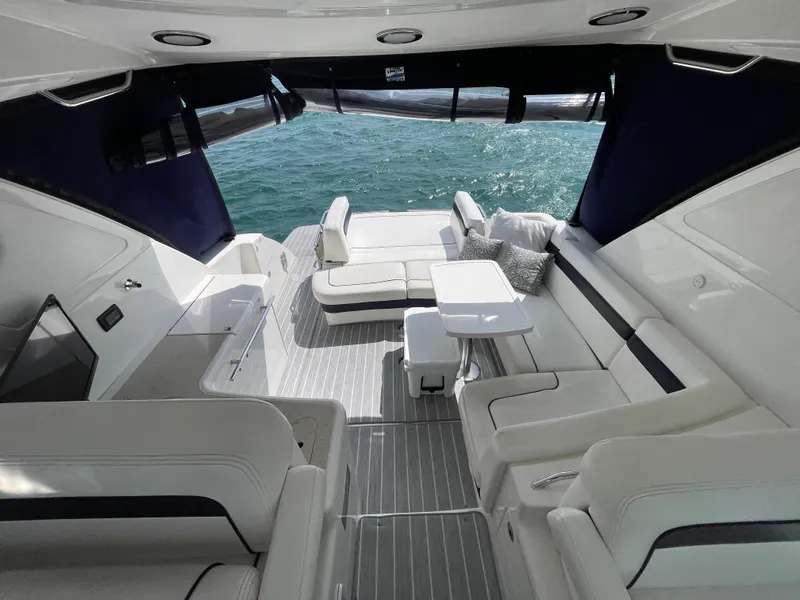 Slide: The Image of Luxurious 2010 Sea Ray 450 Sundancer yacht interior with elegant seating and ocean view. - 40