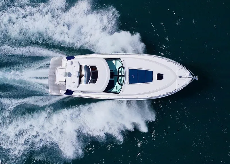 Slide: The Image of Aerial view of 2010 Sea Ray 450 Sundancer yacht cruising on open water. - 5