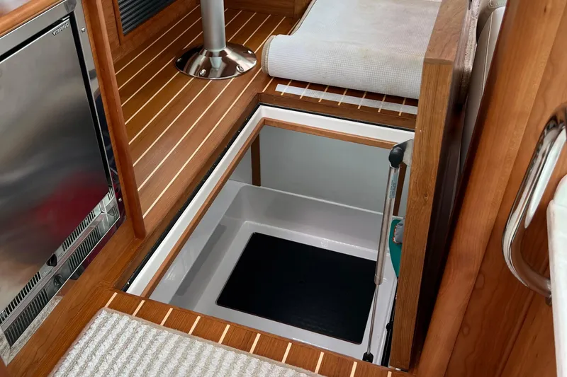 Slide: The Image of 2022 Sabre 45 Salon Express yacht dashboard with Garmin electronics and communication devices. - 24