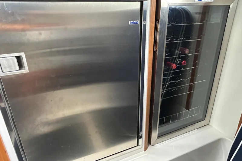 Slide: The Image of Modern kitchen in 2022 Sabre 45 Salon Express with microwave and sink. - 27