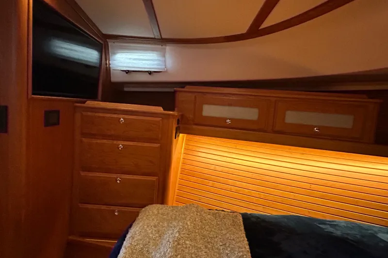 Slide: The Image of Luxurious bathroom interior of 2022 Sabre 45 Salon Express yacht, featuring wood cabinetry. - 41