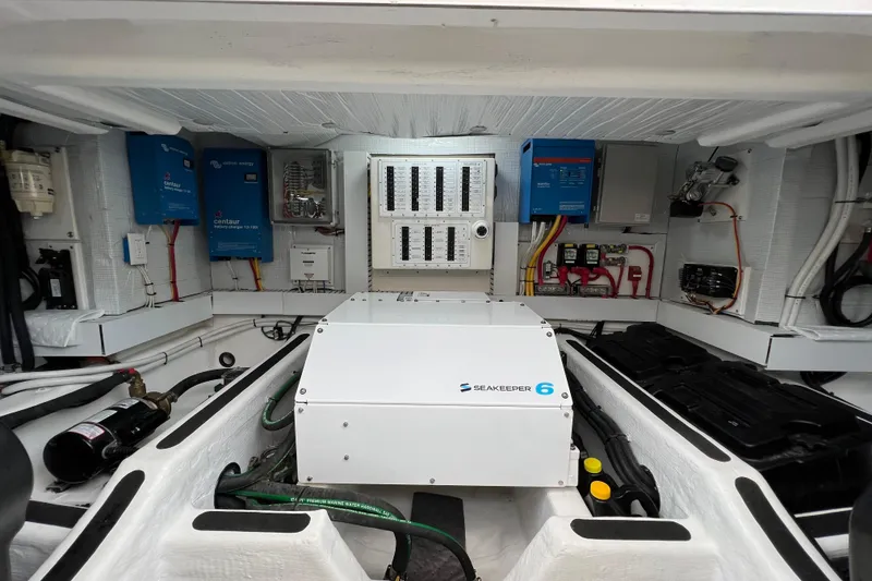 Slide: The Image of 2022 Sabre 45 Salon Express cabin with twin beds, cozy lighting, and plush pillows. - 47