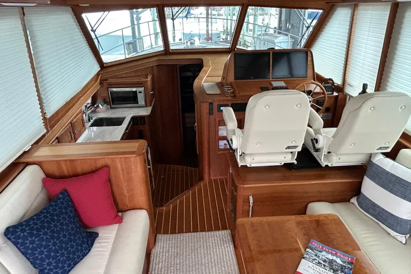 Slide: The Image of Interior of 2022 Sabre 45 Salon Express yacht with helm, seating, and kitchenette. - 63