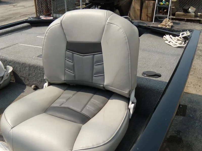 Slide: The Image of 2018 Tracker Pro 160 boat seat with gray upholstery and deck view. - 5