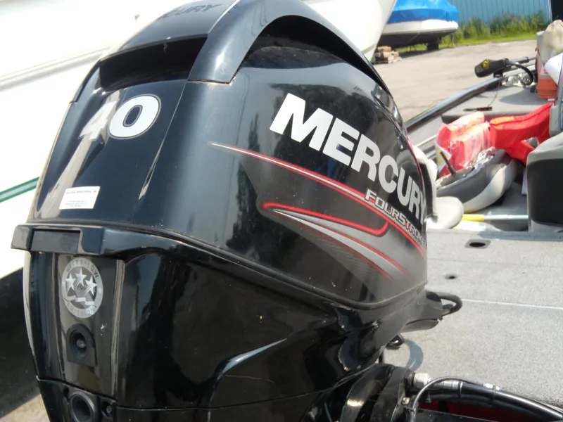 Slide: The Image of Mercury FourStroke outboard motor on 2018 Tracker Pro 160 boat, docked outdoors. - 8