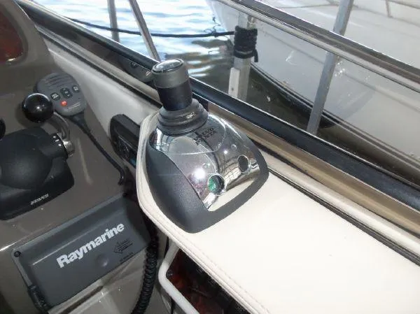 Slide: The Image of Control panel of 2009 Regal Commodore 4060 boat with Raymarine equipment. - 12