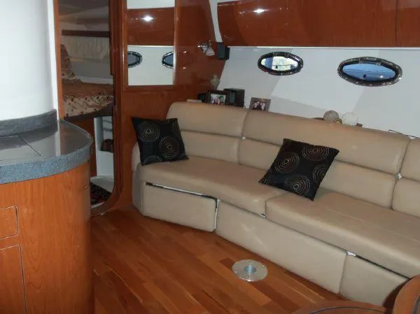 Slide: The Image of Luxurious interior of 2009 Regal Commodore 4060 yacht with leather seating and wood accents. - 13