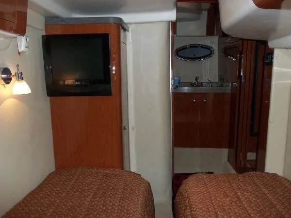 Slide: The Image of Interior of 2009 Regal Commodore 4060 yacht with twin beds and a compact bathroom. - 20
