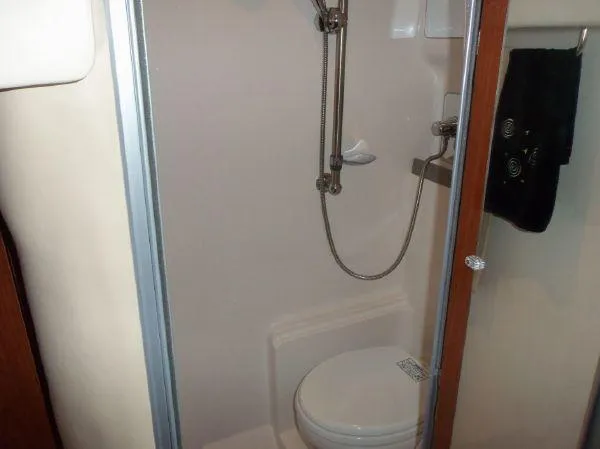 Slide: The Image of Compact bathroom in 2009 Regal Commodore 4060 yacht with shower and toilet. - 22