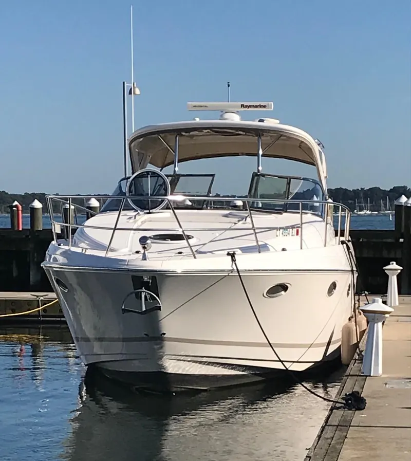 Slide: The Image of 2009 Regal Commodore 4060 yacht docked at marina on a sunny day. - 3