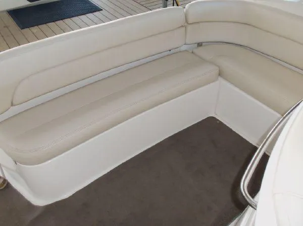Slide: The Image of 2009 Regal Commodore 4060 boat interior with beige seating. - 8