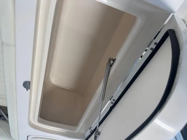 Slide: The Image of Open storage compartment on a 2011 Grady-White Freedom 275 boat. - 13