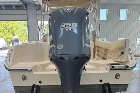 Slide: The Image of 2011 Grady-White Freedom 275 boat with 350 V8 engine in a garage setting. - 15