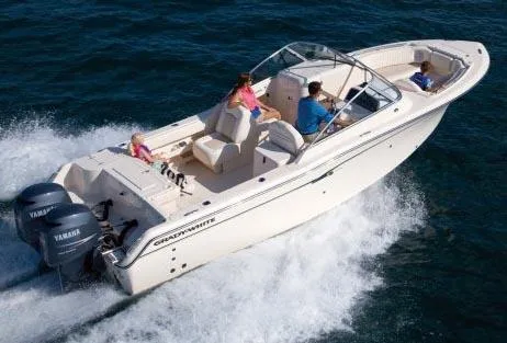 Slide: The Image of 2011 Grady-White Freedom 275 boat cruising on open water with passengers. - 22