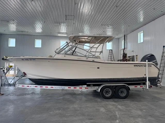 Slide: The Image of 2011 Grady-White Freedom 275 boat on trailer in indoor storage facility. - 3