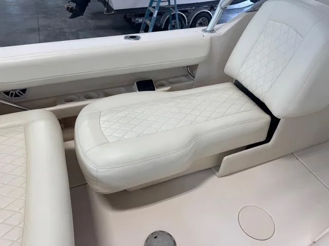 Slide: The Image of Luxurious seating on 2011 Grady-White Freedom 275 boat with diamond-stitched upholstery. - 4