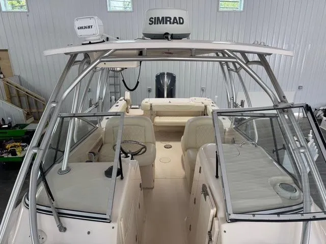 Slide: The Image of 2011 Grady-White Freedom 275 boat interior with Simrad equipment in a storage facility. - 7