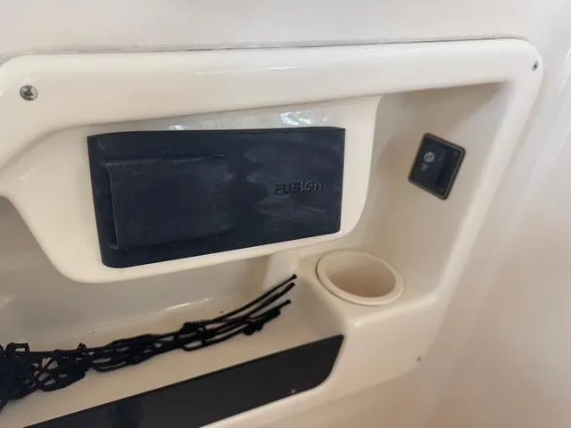 Slide: The Image of Control panel and storage on 2011 Grady-White Freedom 275 boat. - 9