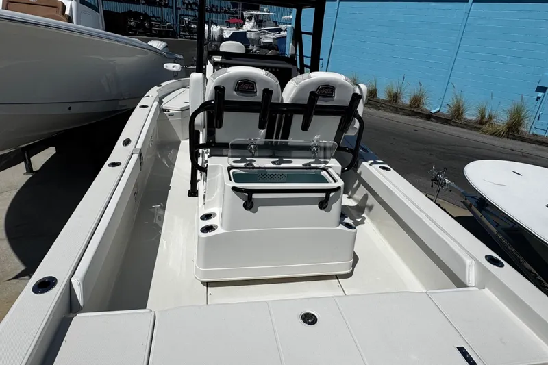 Slide: The Image of 2023 Ranger 2510 Bay boat interior with seating and storage compartments. - 12