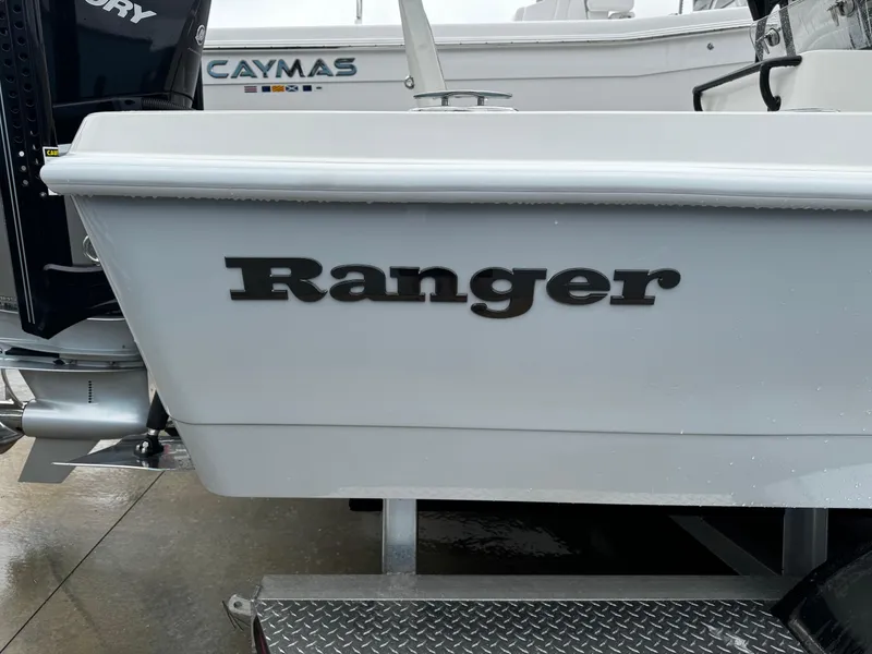 Slide: The Image of 2023 Ranger 2510 Bay boat with visible branding on the side. - 20