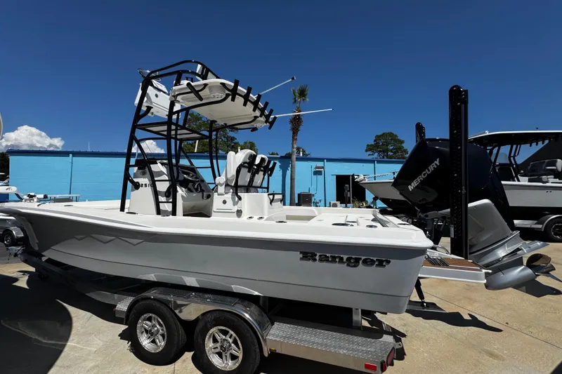Slide: The Image of 2023 Ranger 2510 Bay boat on trailer, featuring sleek design and Mercury engine. - 5