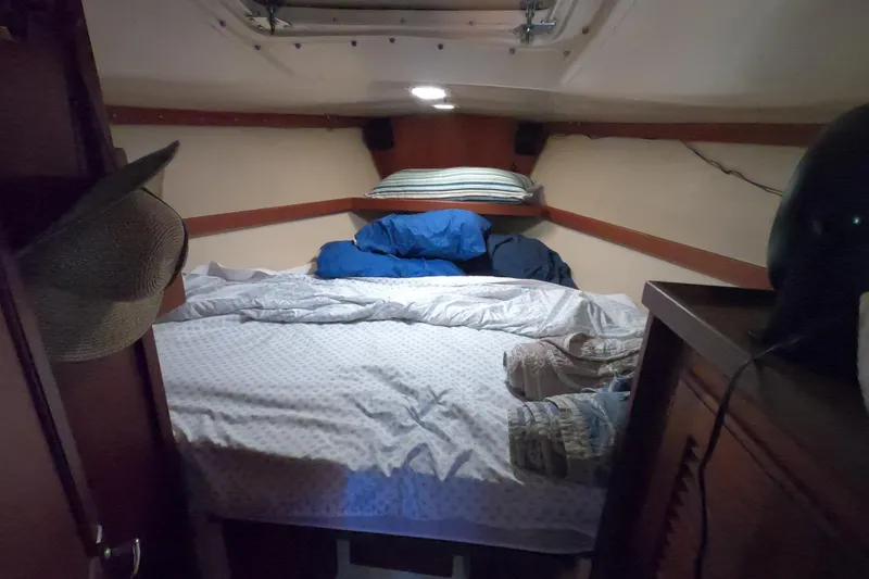 Slide: The Image of Cozy cabin interior of 1983 Catalina 36 sailboat with bed and storage. - 21