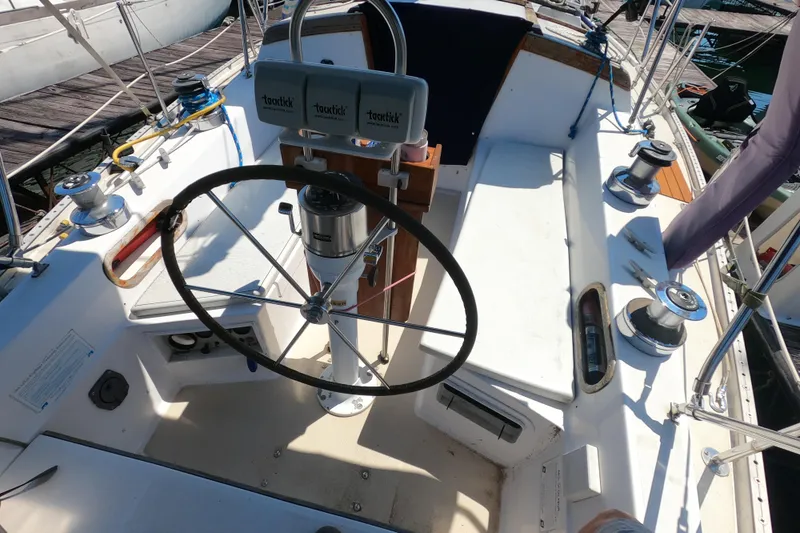 Slide: The Image of Cockpit of a 1983 Catalina 36 sailboat with steering wheel and winches. - 6
