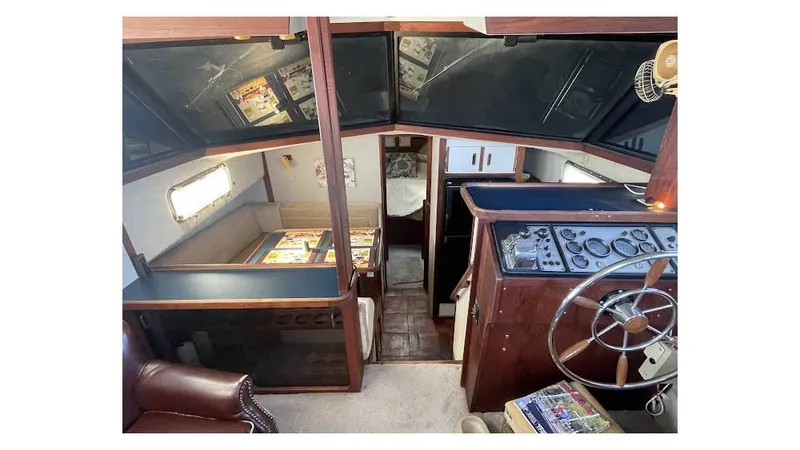 Slide: The Image of 1986 Carver 3607 Aft Cabin kitchen with appliances, sink, and storage cabinets. - 11