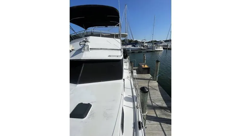 Slide: The Image of Damaged deck of 1986 Carver 3607 Aft Cabin boat with metal ladder. - 6