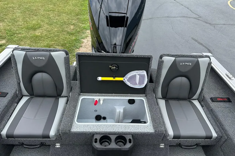 Slide: The Image of 2026 Lund 2075 Impact XS Sport boat interior with seating and storage compartments. - 14