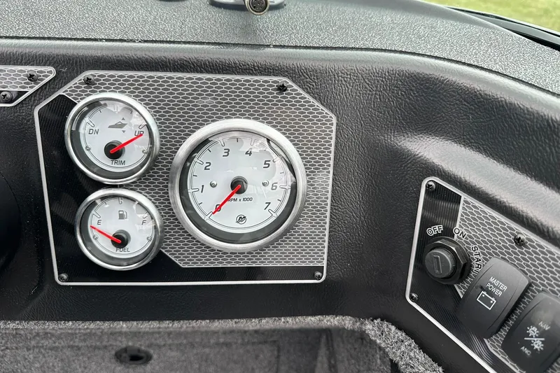 Slide: The Image of Dashboard of 2026 Lund 2075 Impact XS Sport boat with gauges and controls. - 20