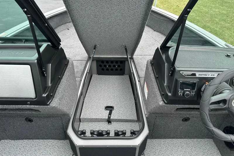 Slide: The Image of 2026 Lund 2075 Impact XS Sport boat interior with open storage compartment. - 26
