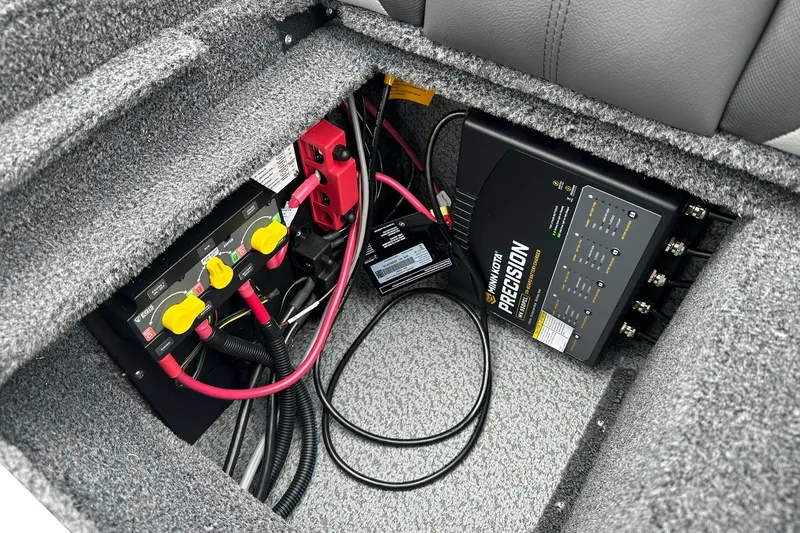 Slide: The Image of Electrical system of 2026 Lund 2075 Impact XS Sport boat, featuring Minn Kota Precision charger. - 38