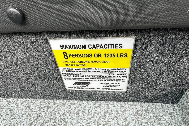 Slide: The Image of Capacity label on 2026 Lund 2075 Impact XS Sport boat, 8 persons or 1235 lbs. - 39