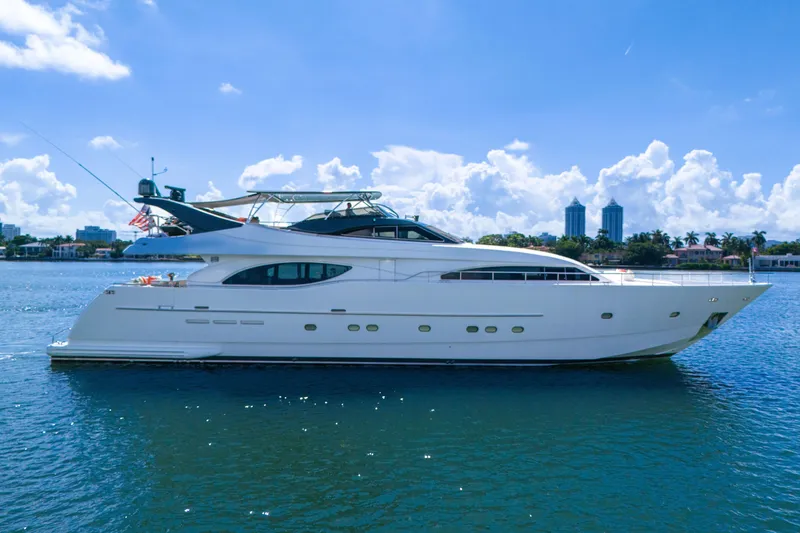 Slide: The Image of Luxury 2002 Ferretti Yachts Custom Line 94 on serene water, clear sky background. - 20