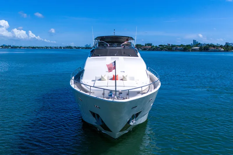 Slide: The Image of Ferretti Yachts Custom Line 94, 2002 model, cruising on a clear blue sea. - 22